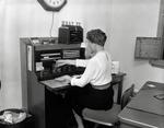 Employee at the WBAY-TV switchboard by WBAY-TV